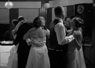 The bridal party dances.