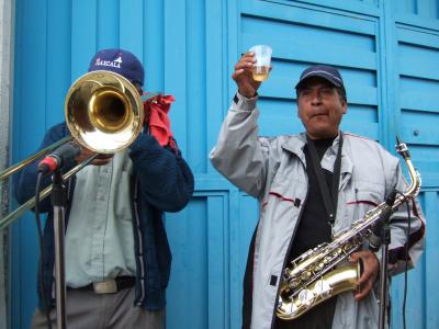 The brass section of the band (rest were on a flatbed truck under tarps)