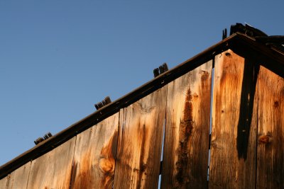 Brilliant colors in aged wood against a blue sky