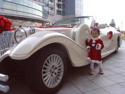 Big car and a small girl