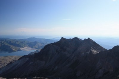 look near middle of picture for white line below rountain tops - that's an airplane inside the crater dome!