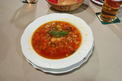Chicken ragout soup with tomato and dill