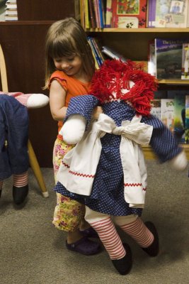 Then it's off to the bookstore where she finds a Raggedy Ann to dance with...