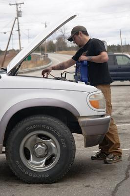 Mar. 23: We retrace yesterday's route stopping at Moody's for tea/coffee and find this youngman jumpstarting a vehicle.
