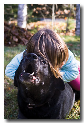 He barks and puts up with it! GOOD Boy!