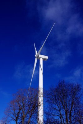 Wind Turbine In  Blue Sky