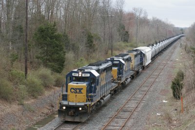 A real treat, a loaded E train with three classic SD40-2's makes its way east at Skillman NJ
