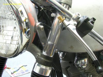 0833 Aluminuim spacer between the headlight bracket and the clip on (hides the fork tube which is not chromed)