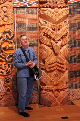 Intricate carvings and weavings along the walls of the meeting house