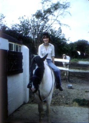 eSlide 15 Lorna in riding hat on horse