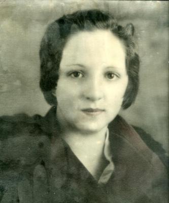 My grandmother on my mother's side at 16. Picture scanned in the frame, has been through a fire and can't be seperated from the glass :-(
