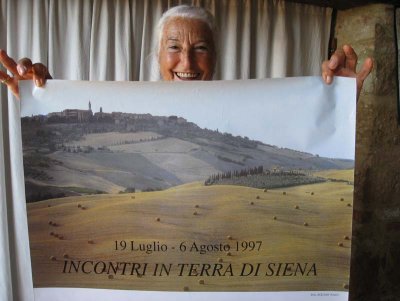 Pinuccia Barbier Meroni, our terrific hostess, with a poster showing 'Le Traverse' at the mid right side of the poster