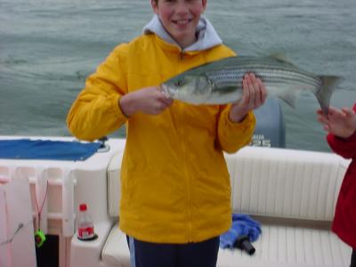 4/14/2006 Charles Jr with a nice 24 release Striper