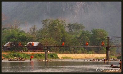 Monks crossing bridge