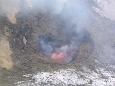 Lava lake 42m diam deep in crater bomb spews all around.JPG
