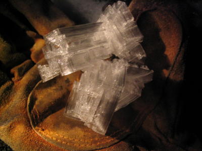 Crystal from deep in cave sitting on glove.JPG