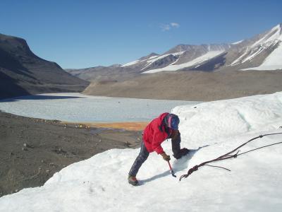 S chopping ice away from anchor master point.JPG