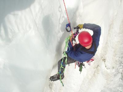 Erik removing loose ice hazards while on rappel.JPG