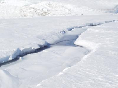 17- Late season crack with snow drifting and water.JPG