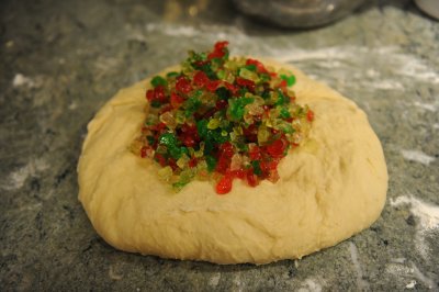 adding the cherries to Christmas bread.JPG