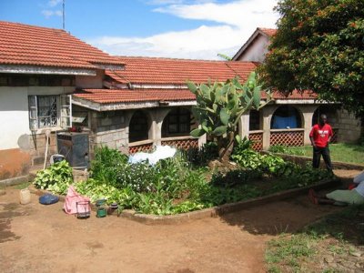 Ben in front of the home
