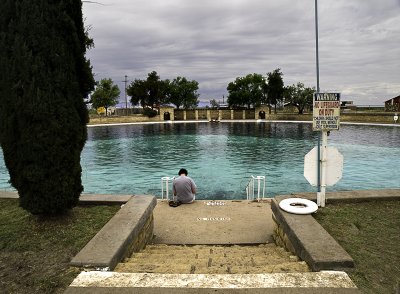 Reader at the steps into the center pool.