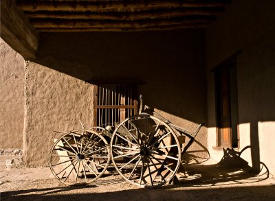 In the small courtyard -- old wagon in sunlight