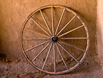 In the small courtyard -- wagon wheel in shade