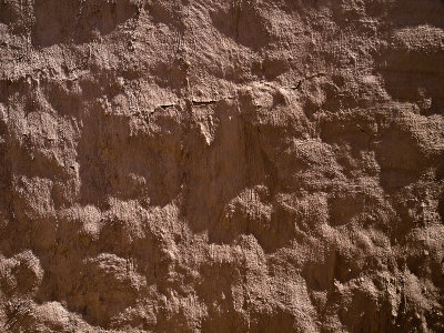 Mud plaster covered adobe