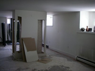 Carpet is gone and so goes some drywall