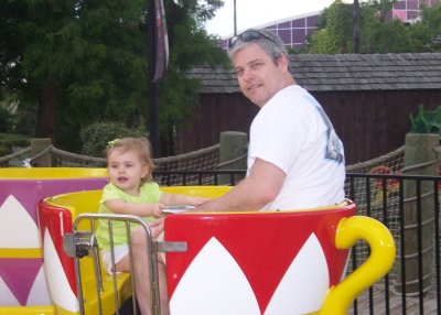 Dizzy tea cup ride with Dad