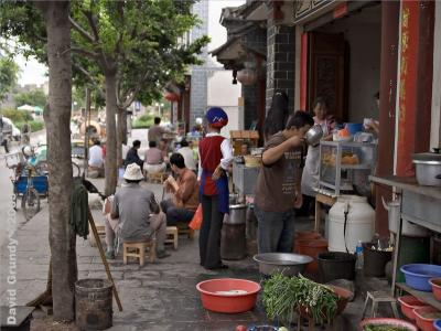 Outside Dali South Gate at breakfast time.  I wasn't quick enough to snap the guy who was drinking from the teapot spout.