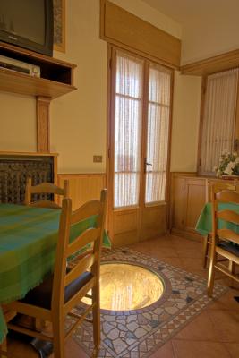 Hotel in Barzio - dining room with old well.jpg