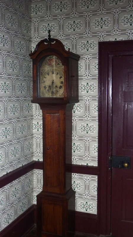 A grandfather clock in the front hallway of the house.