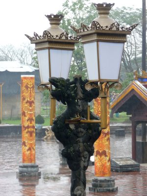 Interesting dragon stone carving between these two lamps.