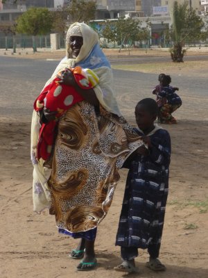 A Senegalese woman and her children outside of the mosque.