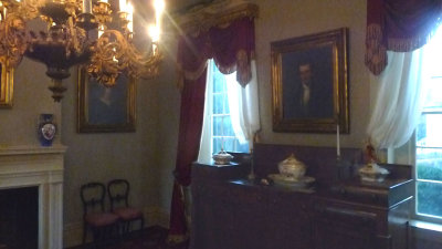 Sideboard, portrait and other furnishings in the dining room.