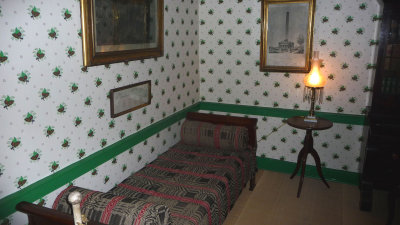In this 2nd story office, the wallpaper is not original but is of that period.  It is called block style paper.