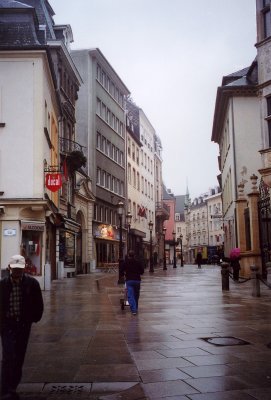 People walking near Place Guillaume. You can tell that it was a rainy day.