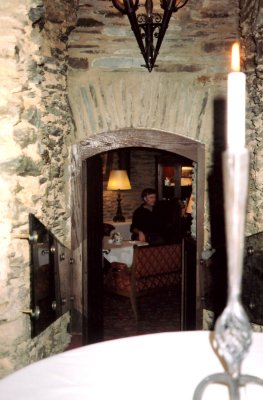 View of me in Schnburg Castle as seen from a distance through a medieval doorway. I like the candle effect in this photo!