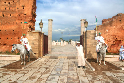 Guards on horseback guarding the entrance to the Hassan Mosque.