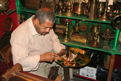 He also took me to a shop where this man was making decorative bronze plates.