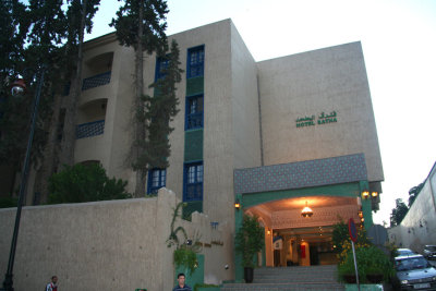 A view at dusk of the exterior of the Hotel Batha.