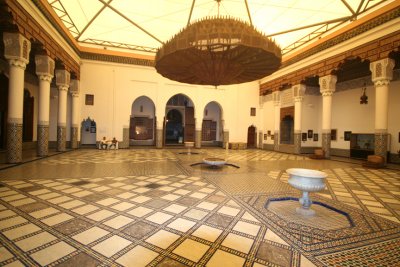 View of the interior of the big house of the palace (which is now the Marrakech Museum) with a large chandelier.