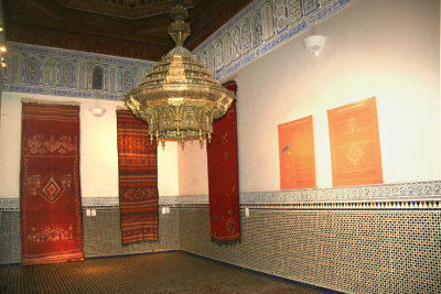 A display of rugs in the Marrakech Museum from the sauna room.