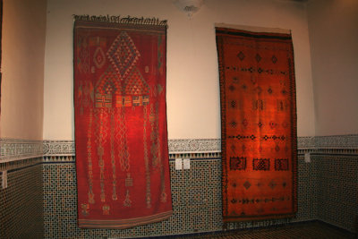 There is red in all of the rugs because the colors signify the house that they are in.