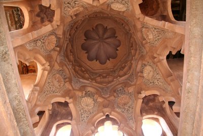 The ornate interior ceiling of the tower of La Qoubba.