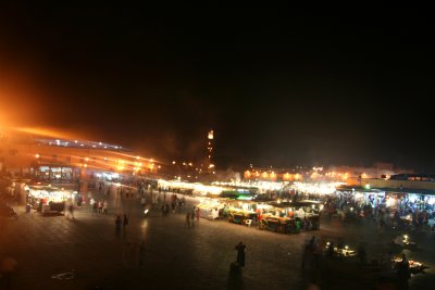 View of Place Djemaa El-Fna at night from the balcony of the Moroccan pizza restaurant.