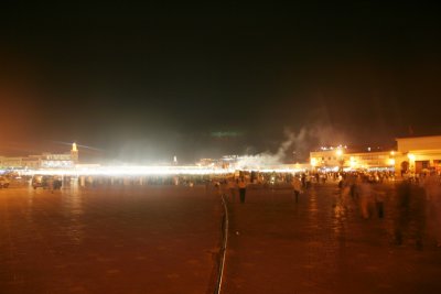 An atmospheric view of Place Djemaa El-Fna with a myriad of acetylene lamps glowing at night.