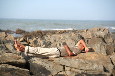 While walking along the corniche, I spotted this Moroccan man taking a nap on the rocks.